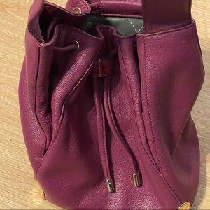 Small Vince Camuto cross body bucket bag.